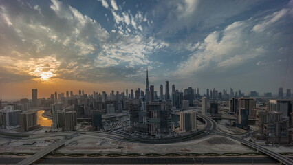 Sunset over panoramic skyline of Dubai with business bay and downtown district timelapse.