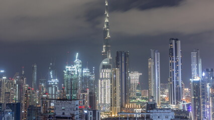 Fototapeta na wymiar Panoramic skyline of Dubai with business bay and downtown district all night timelapse.