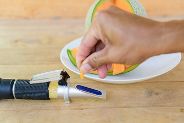 Drop the juice of fresh melon for test sweet level