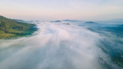 Aerial view, sea of fog covering the village in the morning