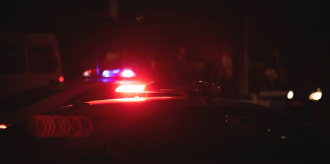 Red and blue light flasher. Police car at night time in the city
