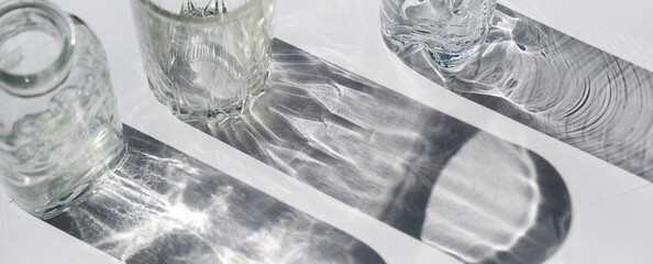 Trendy pattern made with glasses and shadows. glass with sparkling sunlight shadow on the neutral...