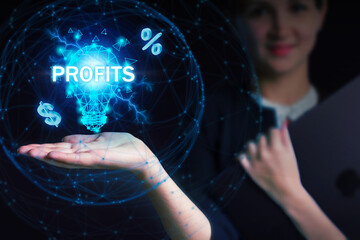 Business, Technology, Internet and network concept. Young businessman working on a virtual screen of the future and sees the inscription: Profits