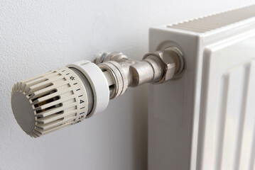 Radiator thermostat on blue background