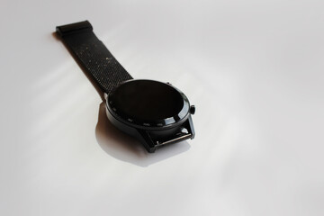 black men's watch on a white background has a place for the inscription