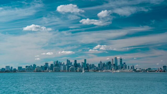 Australia Victoria Melbourne City look from Williamstown Blue sky with high rise buildings and sail boats going past timelapse graceful footage