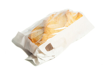 White bread in a paper bag isolated on white background