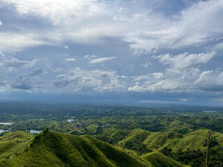 The Binabaje Hills of Brgy. Cambaol in Alica Municipality are featured in the Alicia Panoramic Park. The 400-meter-high hills are covered in tropical perennial grasses known as Cogon.