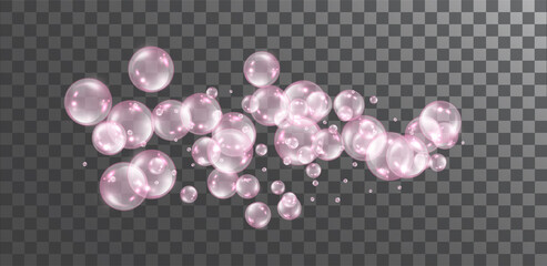 Pink transparent flying soap bubbles on dark transparent background.