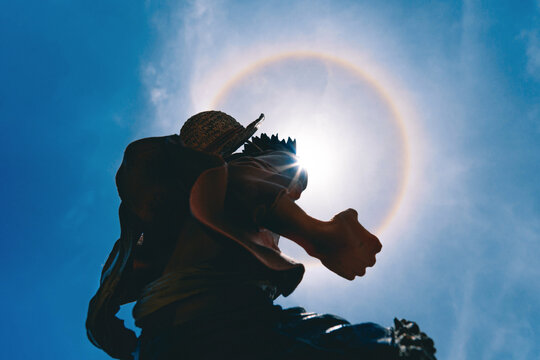 Plastic figurine of Money D.Luffy from One Piece animation with fantastic sun halo. Editorial use only