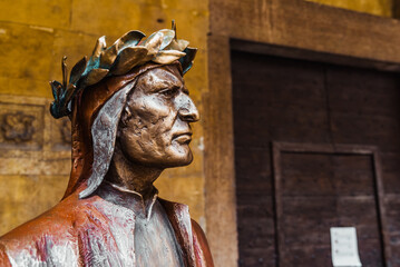 Verona, Italy - September 22, 2021: Bronze statue of.Dante Alighieri, author of the Divine Comedy.