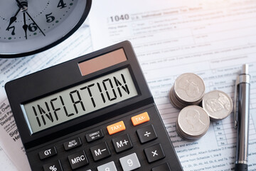 Inflation word on calculator with interest rate hike consideration form Global Economics and Inflation Control US dollar inflation and the income crisis..