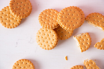 Sandwich cookies on a pink background. The concept of breakfast and a quick snack.