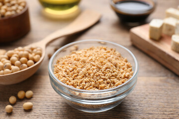 Dried soy meat and other products on wooden table, closeup