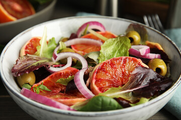 Bowl of delicious sicilian orange salad on table, closeup
