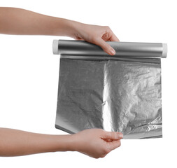 Woman holding roll of aluminum foil on white background, closeup