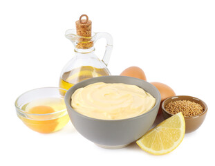 Bowl with fresh mayonnaise and ingredients on white background