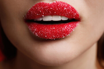 Fototapeta premium Closeup view of woman with lips covered in sugar