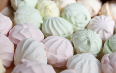 Fresh multicolored marshmallow lies in cardboard packaging prepared for sale in stores
