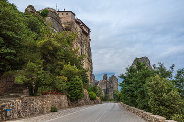 Fototapeta na wymiar Road winding through stone towers and ancient monasteries of Kalambaka in Meteora Region, Greece