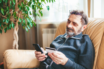 Senior man shopping online