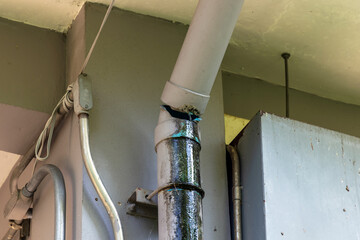 Water leaking from pipe line broken in building. Water drop from drain pipe damage house problem...