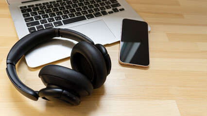 Laptop and headphones on the desk