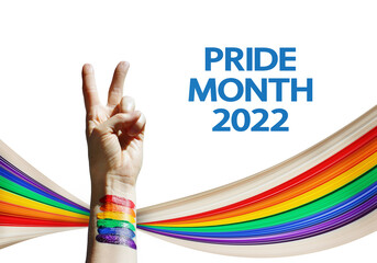 Pride Month 2022 summer concept with pixel stretch effect, mixed media. Woman's hand shows a sign...
