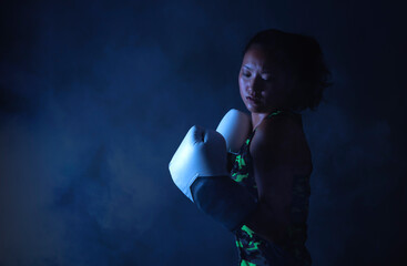 asian ethnicity sportswoman with boxing gloves