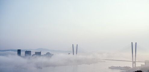 Vladivostok cityscape view. Fog over the city.