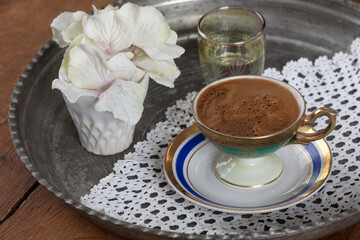 Turkish coffee served in classic Turkish coffee cup