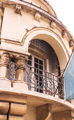 Fototapeta na wymiar Antique tiled balcony with metal grating