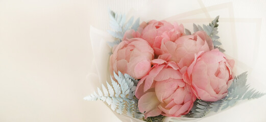 Pink peony bouquet on a white background close-up.