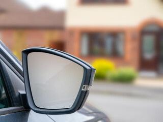 Close up of a car door wing irror with indocator fitting