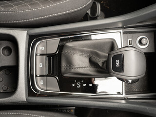 Centre console of a modern Sports Utility vehicle car with DSG automatic transmission