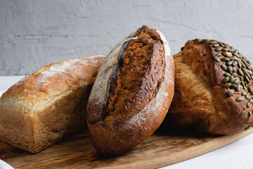 Rye bread on a board on a white tablecloth background