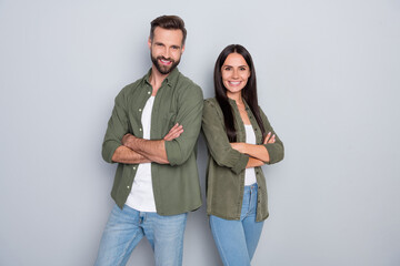 Photo of young lovely couple good mood folded hands bonding wear casual clothes isolated over grey color background