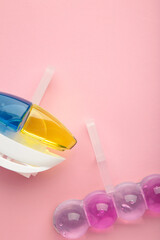 Toilet cleaner on pink background. Toilet balls