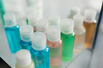 small plastic containers with colored liquids