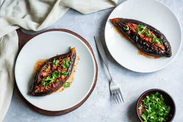 Traditional Turkish food stuffed eggplant, meat, tomato and spices, karniyarik