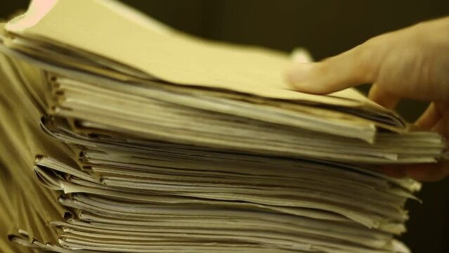 Big stack of old papers, documents, files.