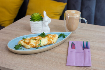 omelet on a nice plate. Delicious breakfast of eggs