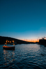 boats at sunset in gumusluk