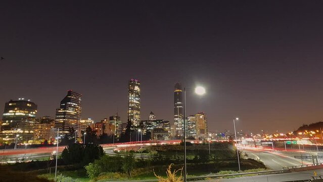 Timelapse Santiago of Chile, buildings and sunset, vehicles passing through the city. 4k Sunset in metropolitan capital city. Dynamic rhythm of time. Way home.