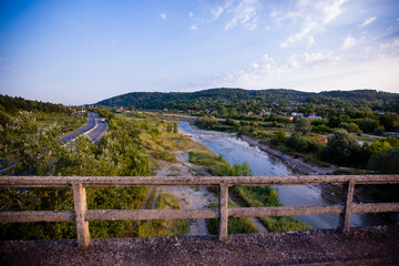 Beautiful landscape with a river and a highway. Shot in Campina, Romania