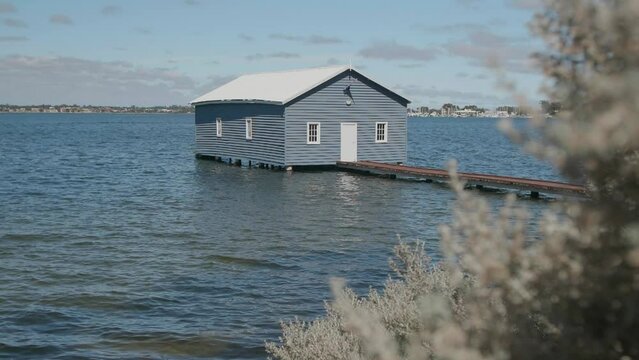 A stationary footage of the Crawley Edge Boatshed, commonly referred to as the Blue Boat House, is a boathouse located on the Swan River at Crawley in Perth, Western Australia. Was built in the 1930s.
