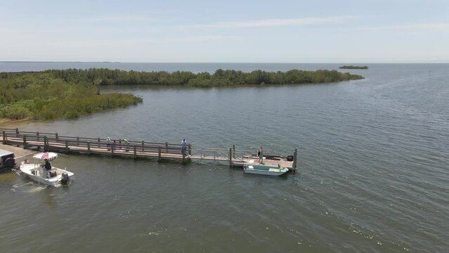Boat launch to the ocean in the middle of mangroves in Florida, aerial view
