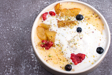 Semolina porridge with raspberry, blueberry and pear ice cream