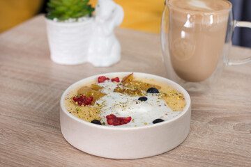 Semolina porridge with raspberry, blueberry and pear ice cream