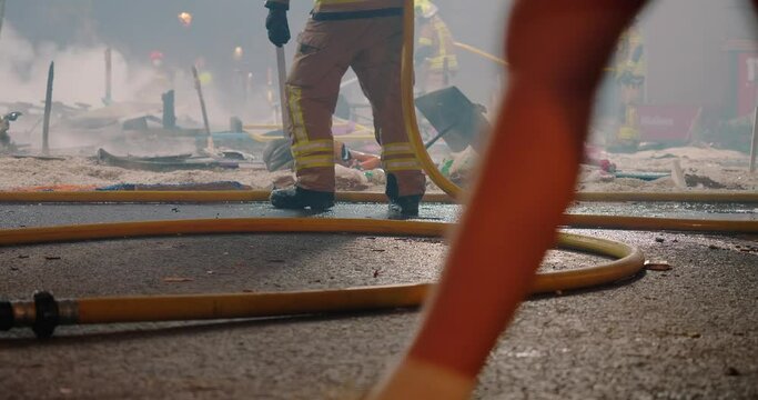 Firefighters put out fire remaining from burning figures